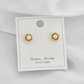 Aretes  baño de oro topos flor y perla A18